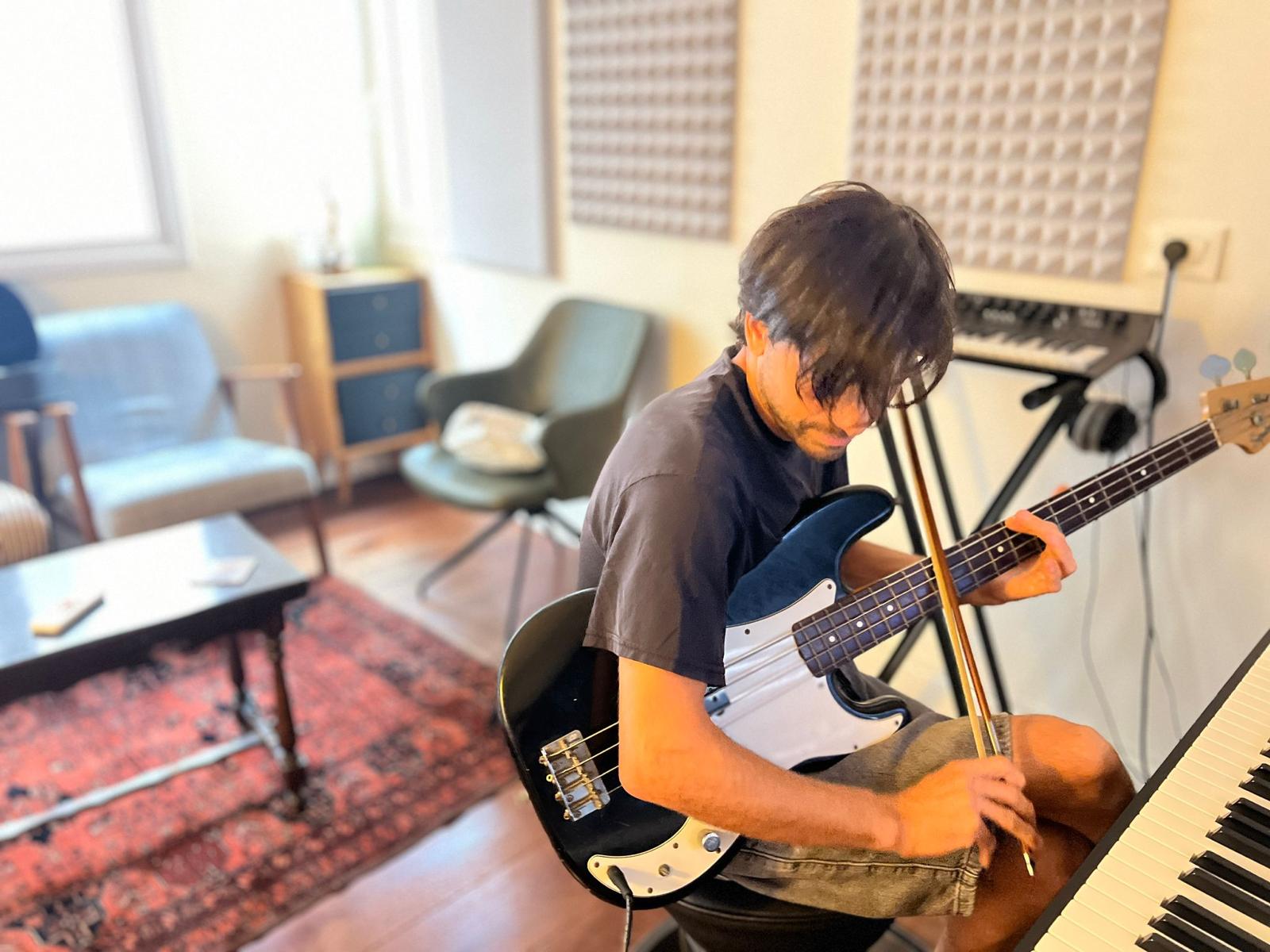 Gal Lev exploring bowed electric bass in his studio